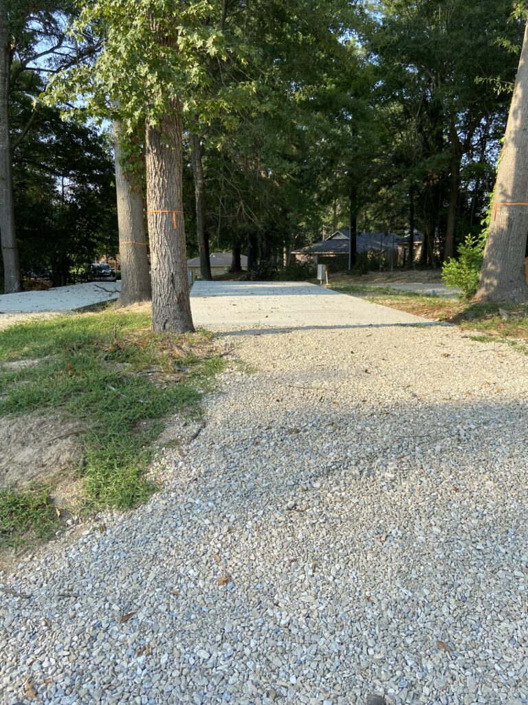 RV spot 1 with 50/30 amp hookups, sewer, and water on 12x35 concrete pad