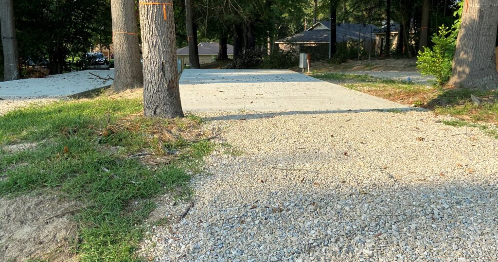RV spot 1 with 50/30 amp hookups, sewer, and water on 12x35 concrete pad