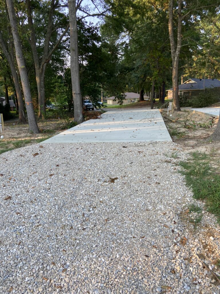 RV spot 2 with 50/30 amp hookups, sewer, and water on 12x35 concrete pad