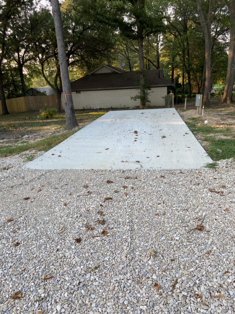 RV spot 3 with 50/30 amp hookups, sewer, and water on 12x32 concrete pad
