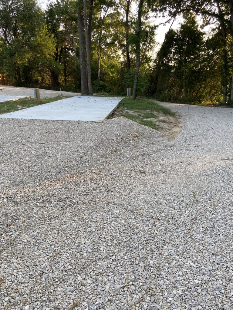 RV spot 7 with 50/30 amp hookups, sewer, and water on 12x35 concrete pad