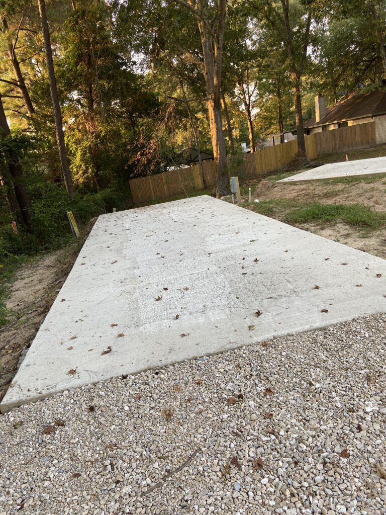 Premium RV spot 6 with 50/30 amp hookups, sewer, and water on 12x36 concrete pad with full tree shade