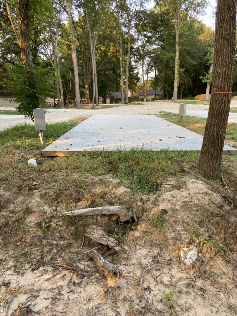 RV spot 7 with 50/30 amp hookups, sewer, and water on 12x35 concrete pad