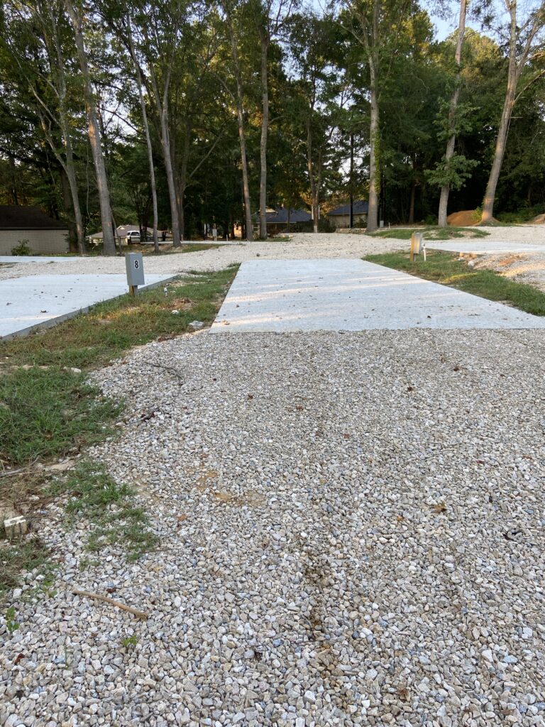 RV spot 8 with 50/30 amp hookups, sewer, and water on 12x39 concrete pad