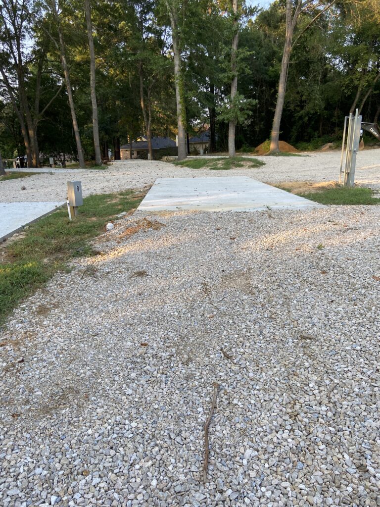 RV spot 9 with 50/30 amp hookups, sewer, and water on 12x30 concrete pad