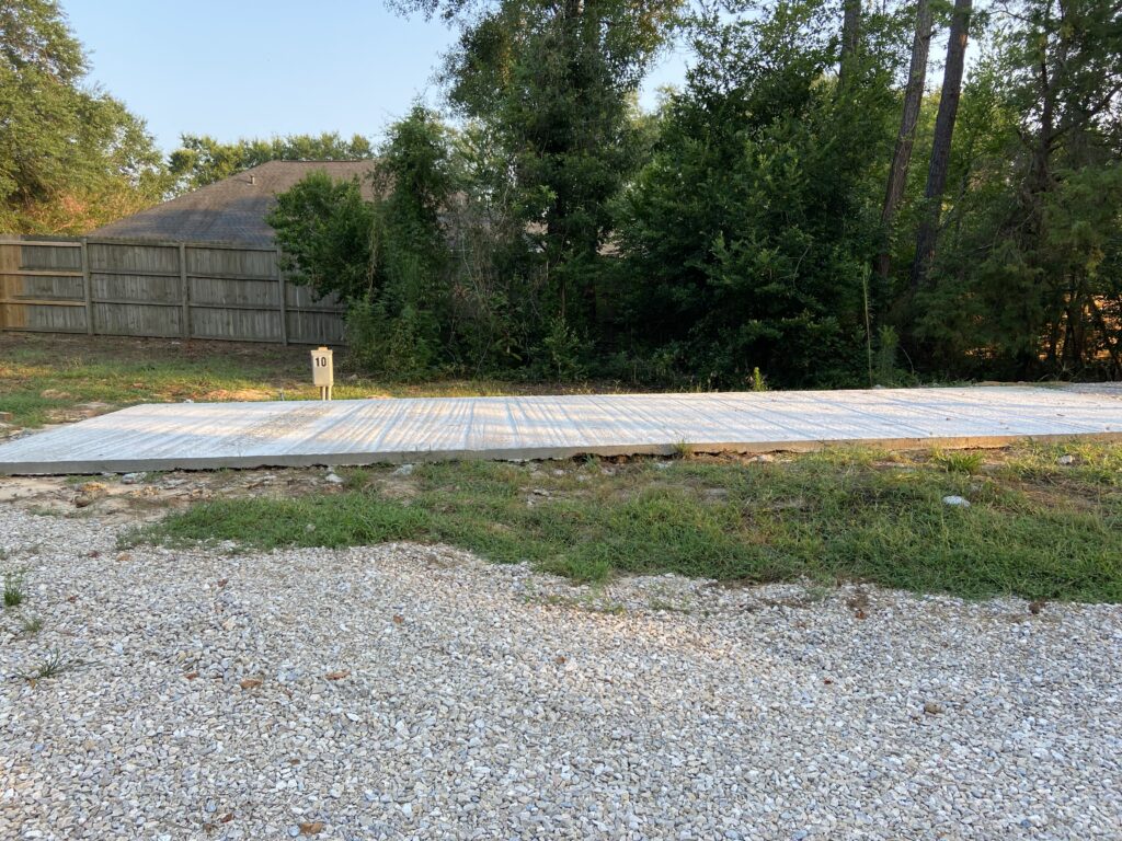 RV spot 10 with 50/30 amp hookups, sewer, and water on 12x35 concrete pad