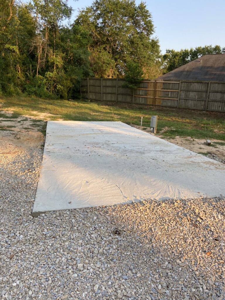 RV spot 11 with 50/30 amp hookups, sewer, and water on 12x30 concrete pad
