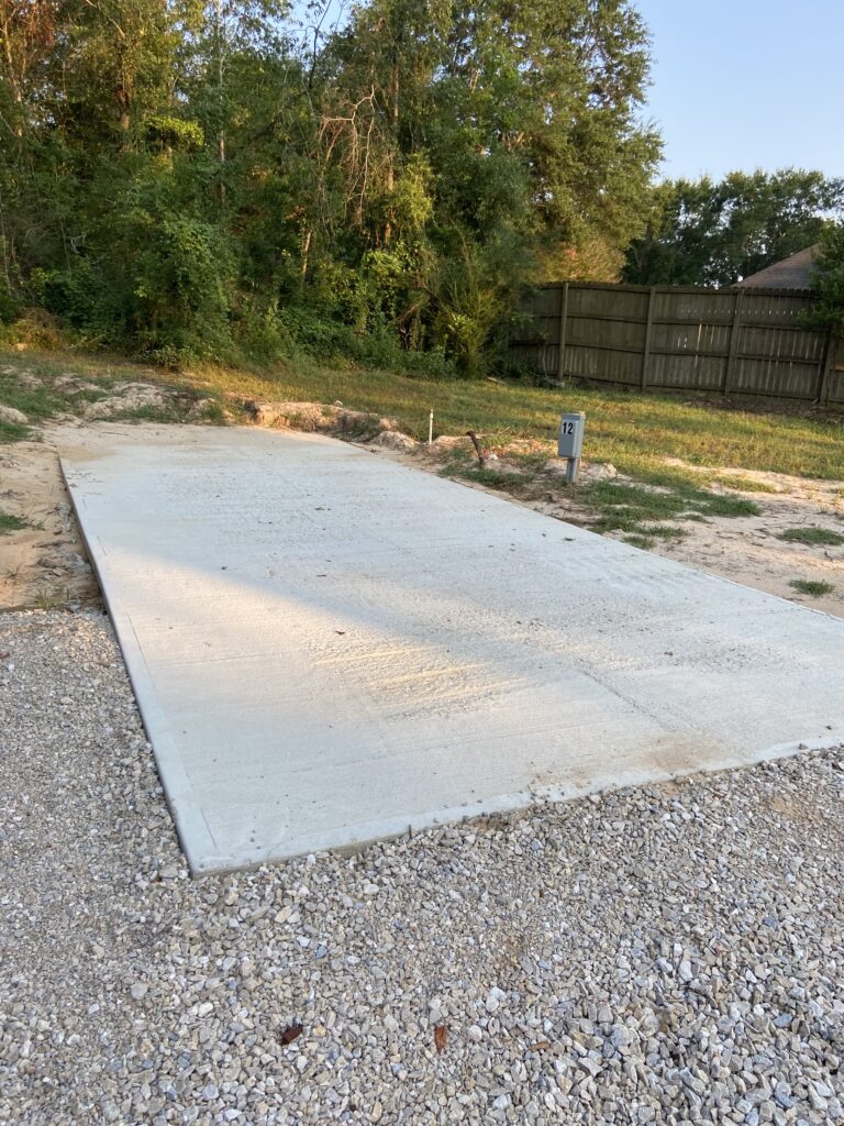 RV spot 12 with 50/30 amp hookups, sewer, and water on 12x35 concrete pad