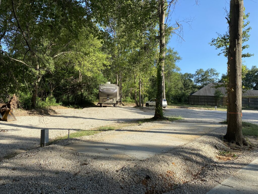 RV spot 1 with 50/30 amp hookups, sewer, and water on 12x35 concrete pad