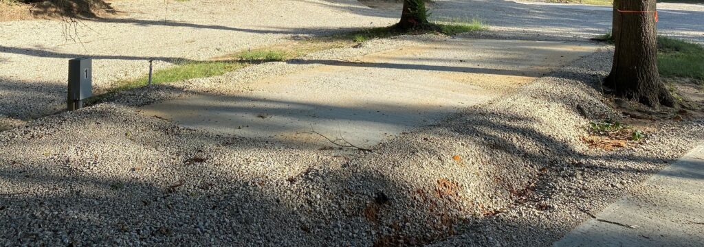 RV spot 1 with 50/30 amp hookups, sewer, and water on 12x35 concrete pad