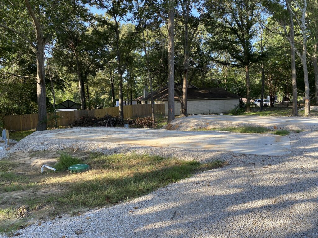 RV spot 5 with 50/30 amp hookups, sewer, and water on 12x35 concrete pad