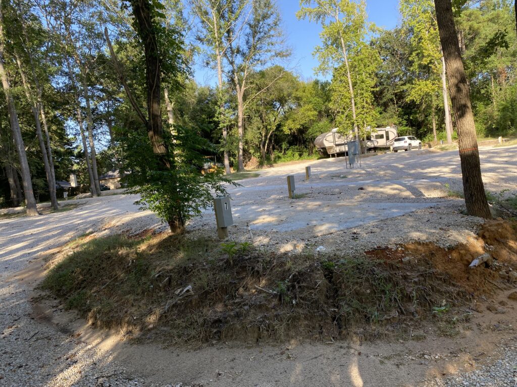 RV spot 7 with 50/30 amp hookups, sewer, and water on 12x35 concrete pad