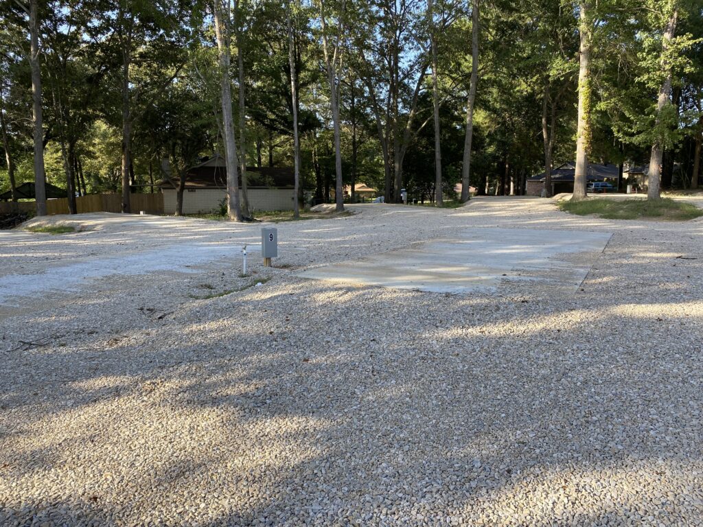 RV spot 9 with 50/30 amp hookups, sewer, and water on 12x30 concrete pad