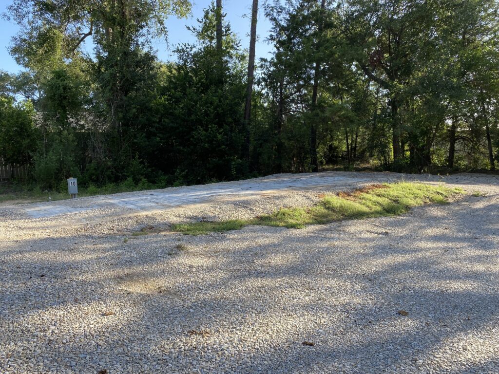 RV spot 10 with 50/30 amp hookups, sewer, and water on 12x35 concrete pad