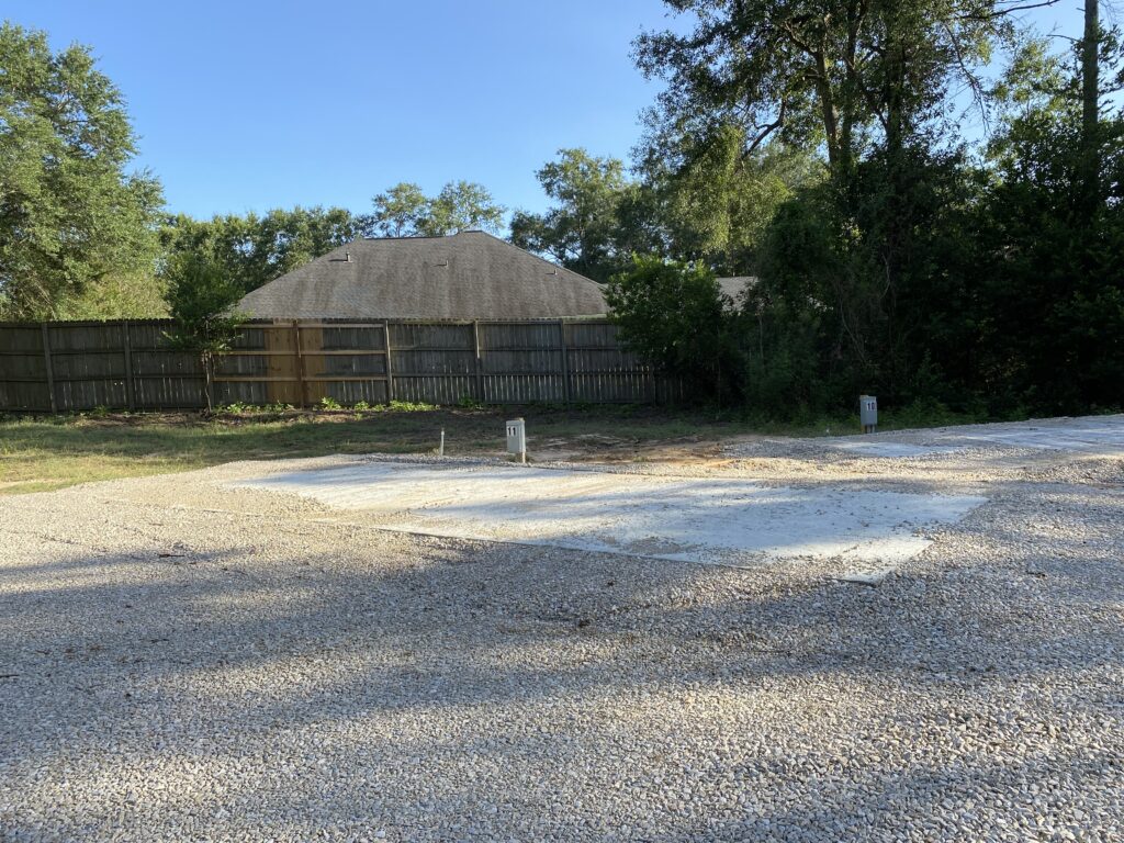RV spot 11 with 50/30 amp hookups, sewer, and water on 12x30 concrete pad