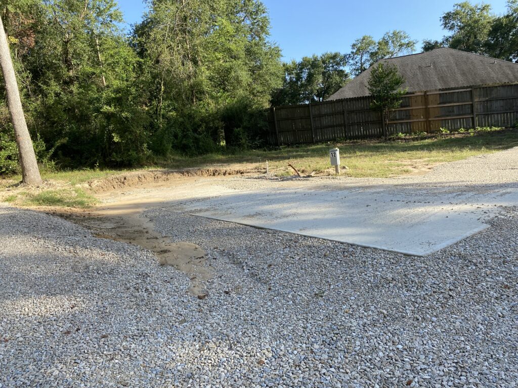RV spot 12 with 50/30 amp hookups, sewer, and water on 12x35 concrete pad