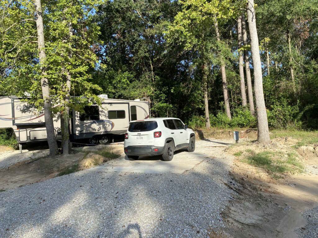 RV spot 13 with 50/30 amp hookups, sewer, and water on 12x35 concrete pad