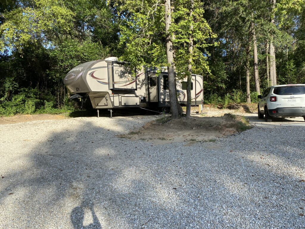 RV spot 14 on a corner lot with full hookups, offering extra space and privacy on a 12x40 concrete pad