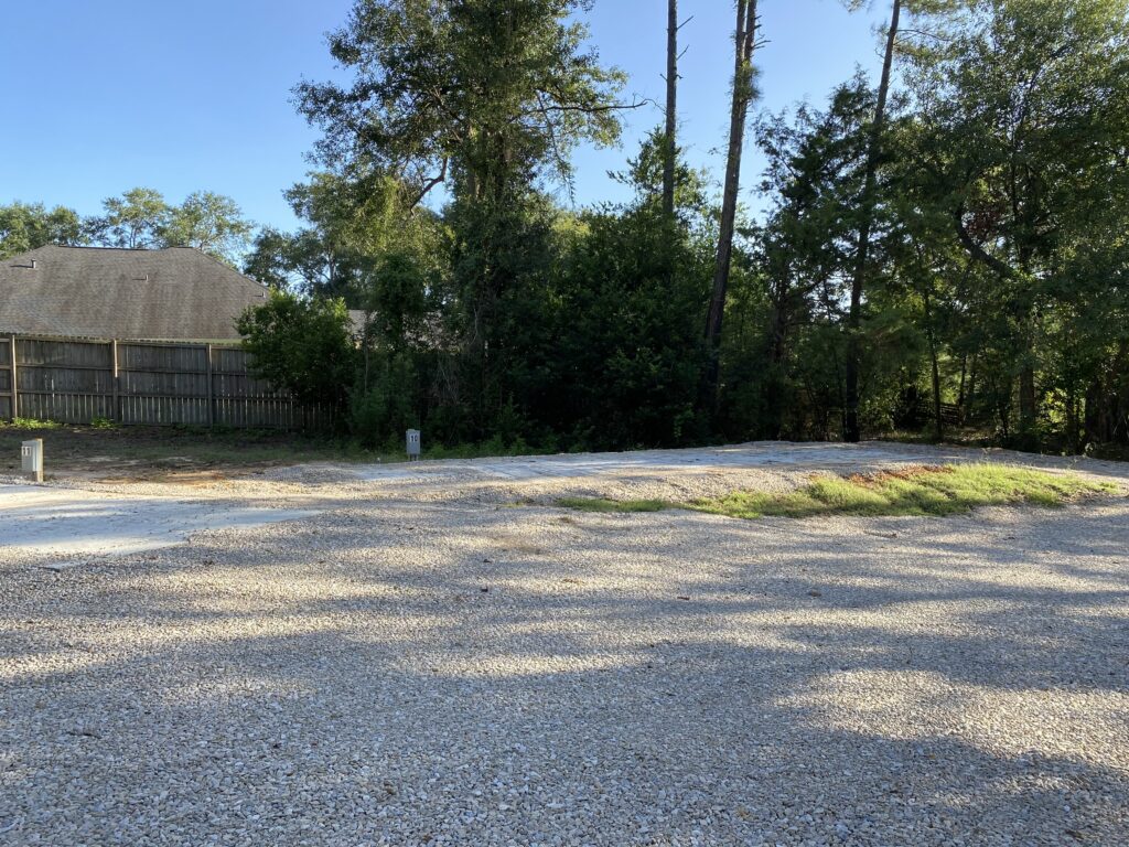RV spot 10 with 50/30 amp hookups, sewer, and water on 12x35 concrete pad