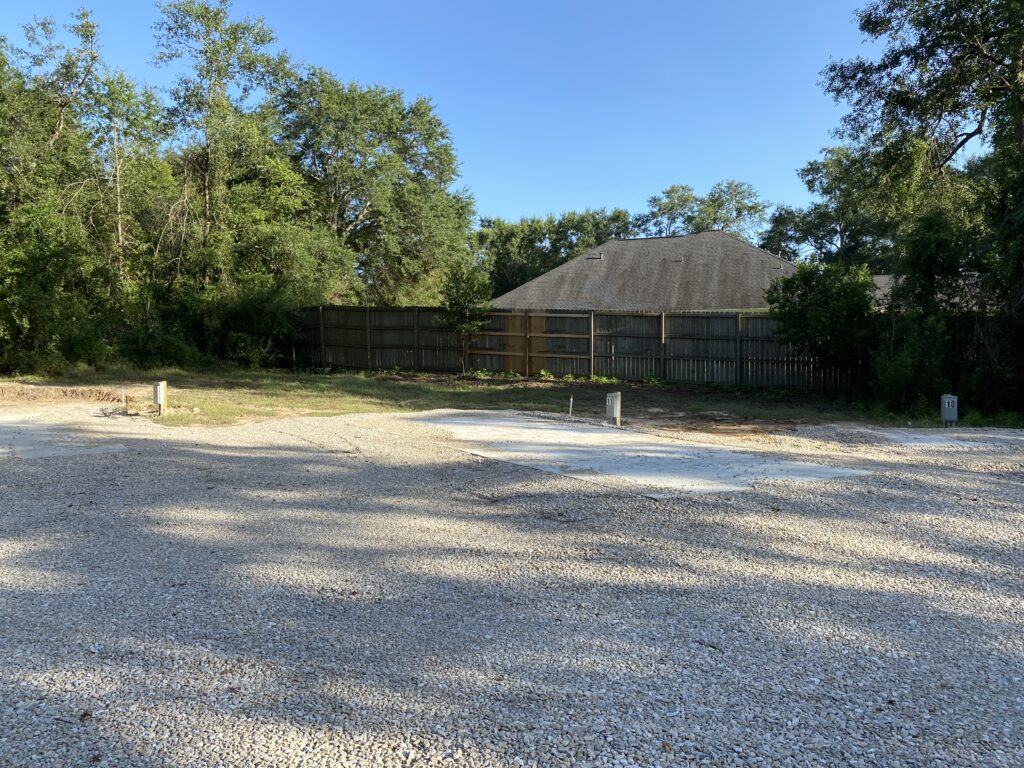 RV spot 11 with 50/30 amp hookups, sewer, and water on 12x30 concrete pad