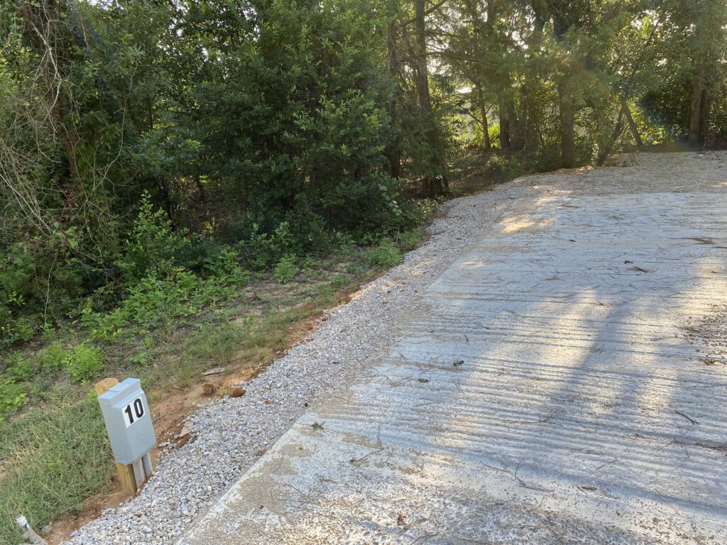 RV spot 10 with 50/30 amp hookups, sewer, and water on 12x35 concrete pad