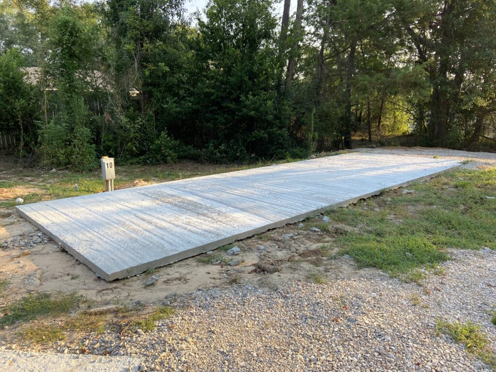 RV spot 10 with 50/30 amp hookups, sewer, and water on 12x35 concrete pad